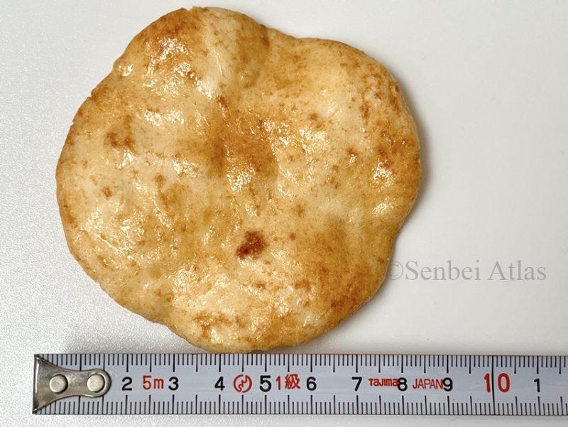 Magari Senbei next to a measuring tape