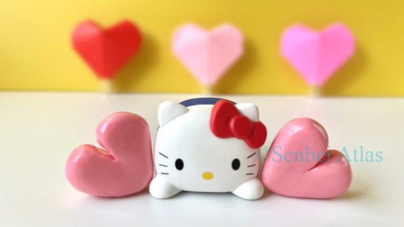 Hello Kitty (ハローキティ) happily surrounded by hearts, representing 'Jibun' chocolate (自分チョコ) or 'Gohoubi' chocolate (ご褒美チョコ) as a special self-reward.