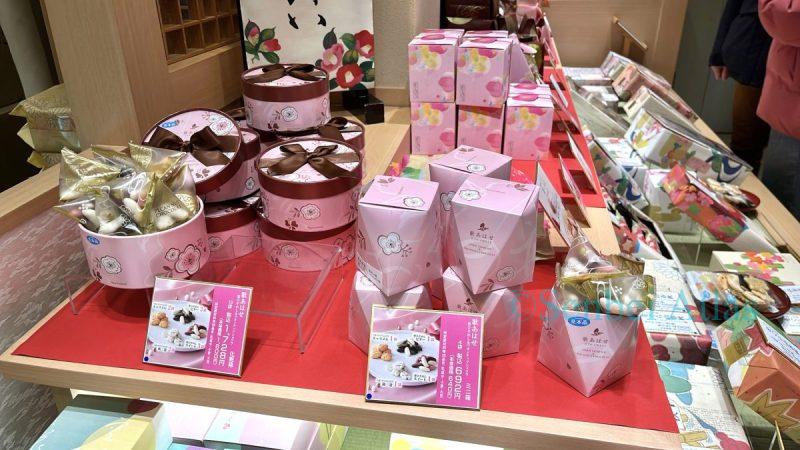 Ogura Sansou's Valentine's package featuring pale pink floral designs and a box with a chocolate brown ribbon.