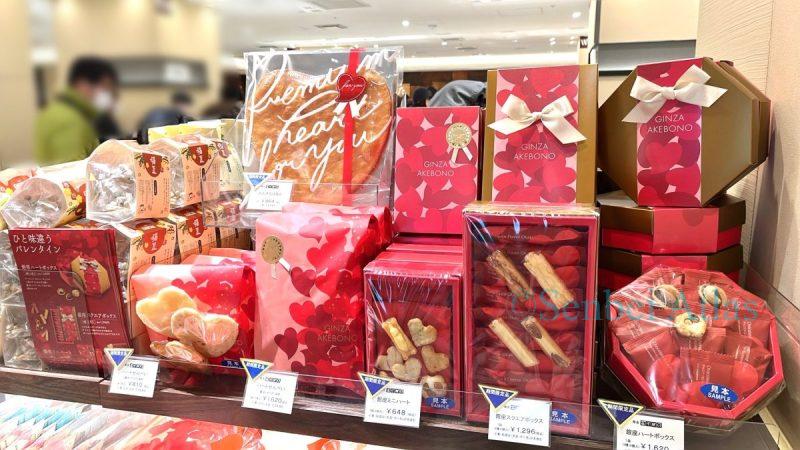 The packaging for Ginza Akebono's Valentine's Day limited edition rice crackers features a velvet red design covered in hearts.