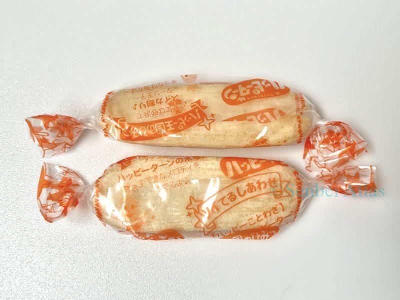 Individually wrapped Happy Turn (ハッピーターン) crackers in their signature twisting plastic film.