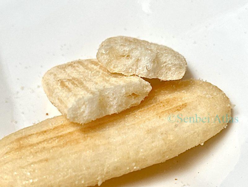 Cross-section of a Happy Turn (ハッピーターン) cracker, showing the airy texture inside.