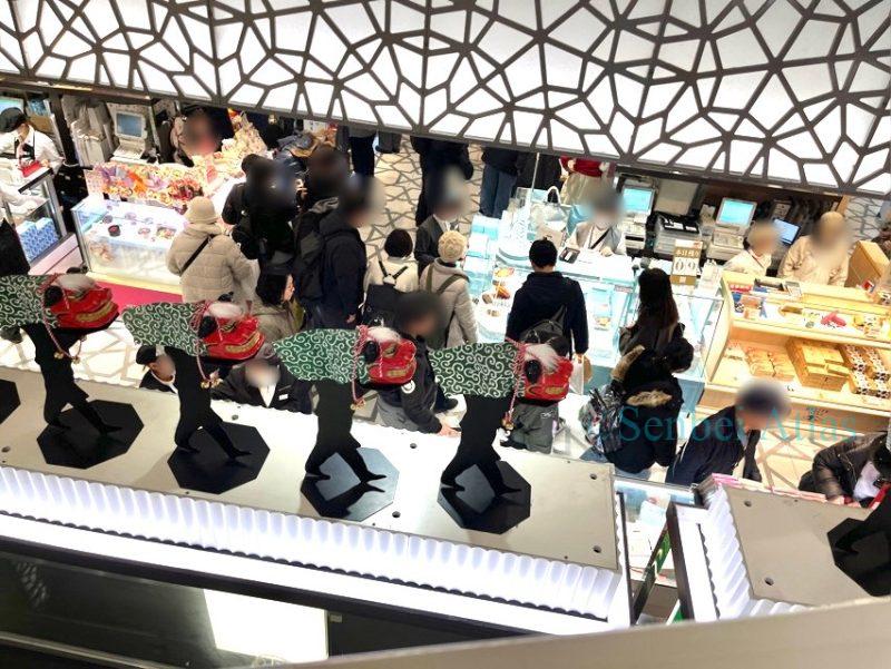 Crowded depachika (department store basement) food hall during New Year holidays in Japan