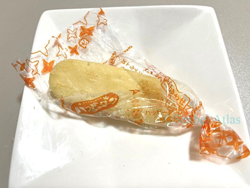 A Happy Turn cracker, half-peeled like a banana