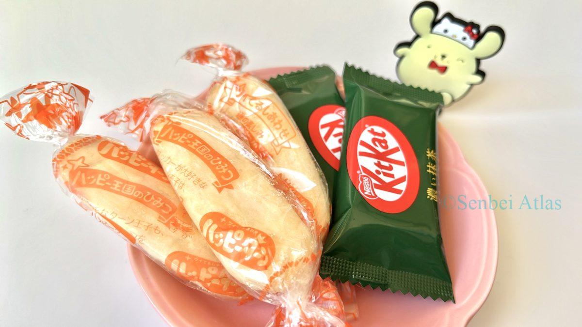 Matcha KitKat and Happy Turns sit on a plate, with Pompompurin behind them.
