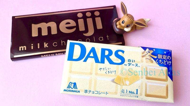 Packages of Meiji Milk Chocolate (明治ミルクチョコレート) and Morinaga DARS (森永製菓 ダース) with an Eevee (イーブイ) Figure.