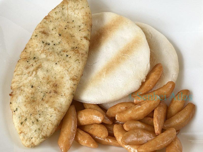 Three types of Japanese rice crackers on a plate: Bakauke (ばかうけ), soft senbei, and Kaki-no-Tane (柿の種).