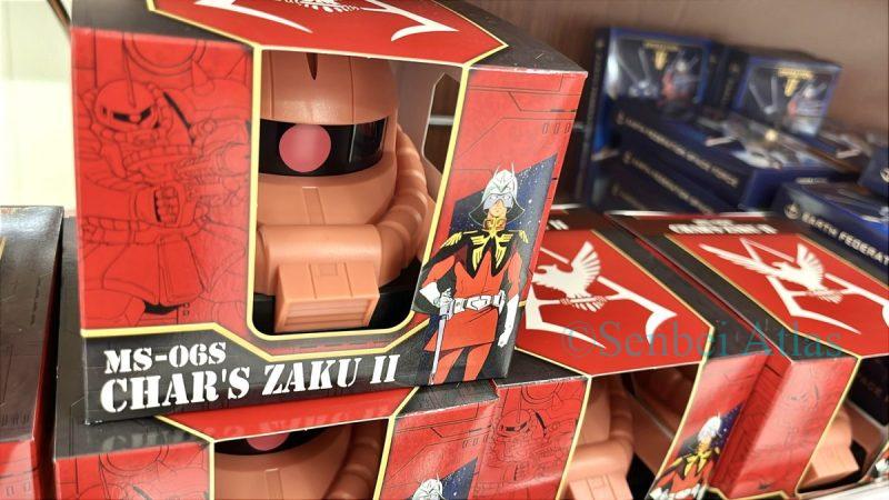 Chocolates in a case shaped like Char's Zaku (シャア専用ザク) head, specifically the product 'Char's Zaku Chocolate Case' (シャア専用ザクチョコケース).