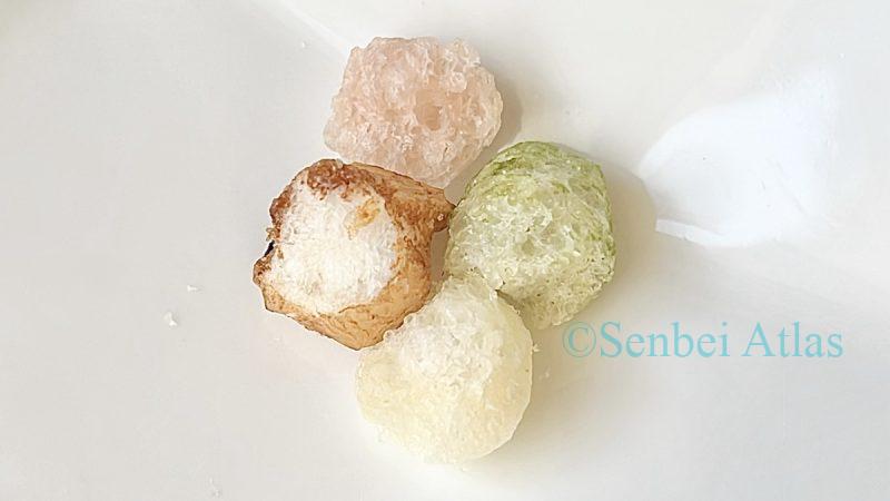 Cross-section of a Hina Arare (ひなあられ) piece showing the light and crispy texture of Japan's savory umami rice snacks.