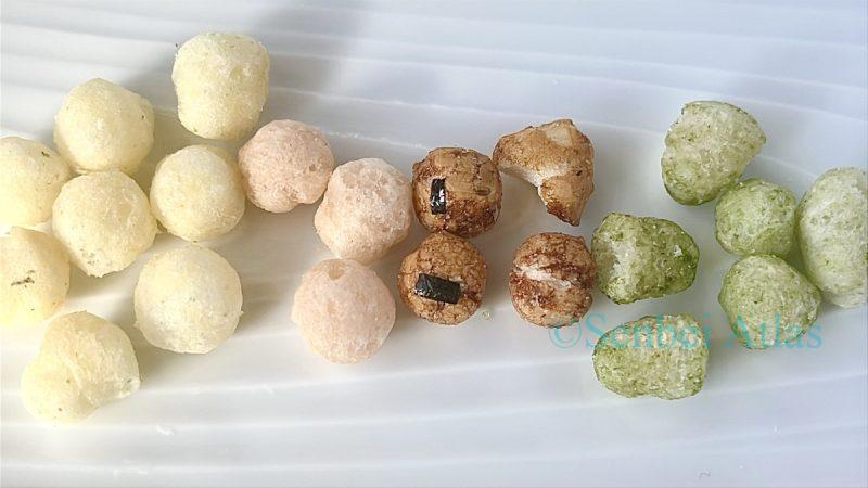 Four different colors and flavors of Echigo Seika (越後製菓) Hina-arare (ひなあられ) arranged on a plate.