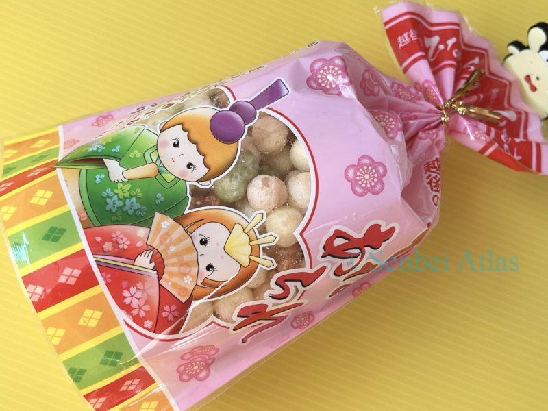 Overall package of Echigo Seika (越後製菓) Hina Arare (ひなあられ) with Pompompurin (ポムポムプリン) in the background.