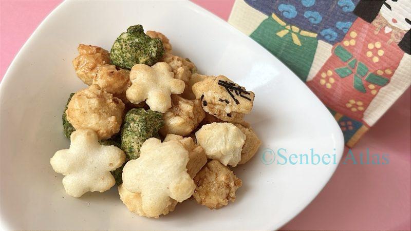 Savory snacks from the Ginza Akebono (銀座あけぼの) Hina-arare (ひなあられ) assortment served on a plate.
