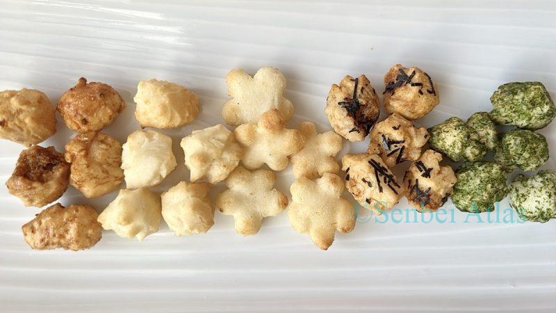 Different types of savory snacks from Ginza Akebono (銀座あけぼの) Hina-arare (ひなあられ) sorted by flavor on a dish.