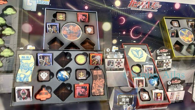 A display of Gundam (ガンダム) chocolates for Valentine's Day. Gundam, Amuro, mass-produced Zaku, Char's Zaku, Haro, and pyramid-shaped Earth Federation chocolates are all lined up.