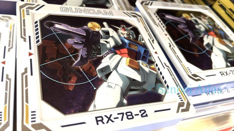 An embossed can with a Gundam design featuring the product 'Lock-on Chocolate Tin: Gundam VS Principality of Zeon MS' (ロックオンチョコ缶 ガンダムVSジオン公国軍MS).