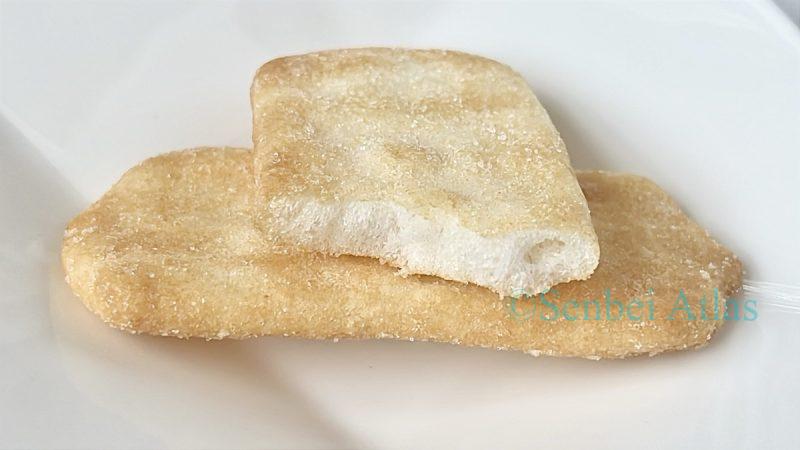 A cross-section of an Ajishirabe (味しらべ) cracker showing its light texture.