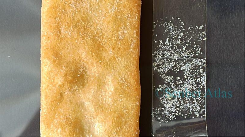 Close-up of Ajishirabe (味しらべ) and its umami powder collected on cellophane tape.