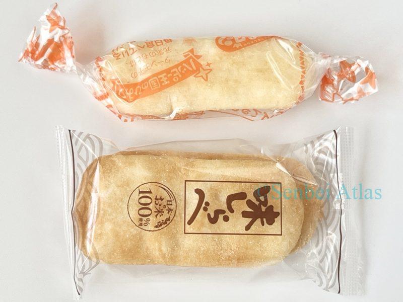 Individual wrappers of Happy Turn (ハッピーターン) and Ajishirabe (味しらべ) lined up vertically for a close-up comparison.