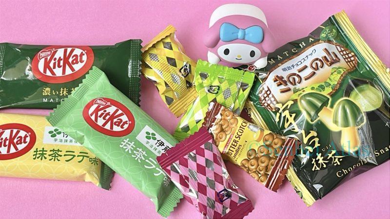 Various individual snack wrappers including Matcha Kit Kat (抹茶キットカット) with a My Melody (マイメロディ) figure.