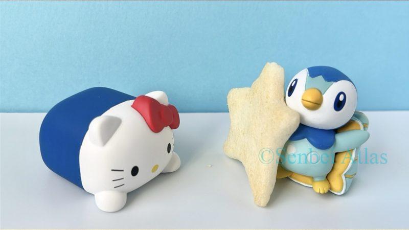 A White Day (ホワイトデー) themed photo of a Piplup figure giving a star-shaped rice cracker Hoshitabeyo (星たべよ) to a Hello Kitty figure.