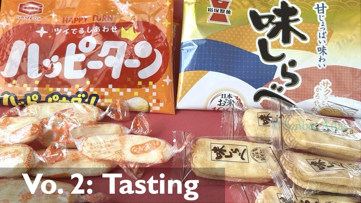 A playful "battle formation" featuring stacks of Happy Turn (ハッピーターン) and Ajishirabe (味しらべ) crackers with their original packaging in the background.