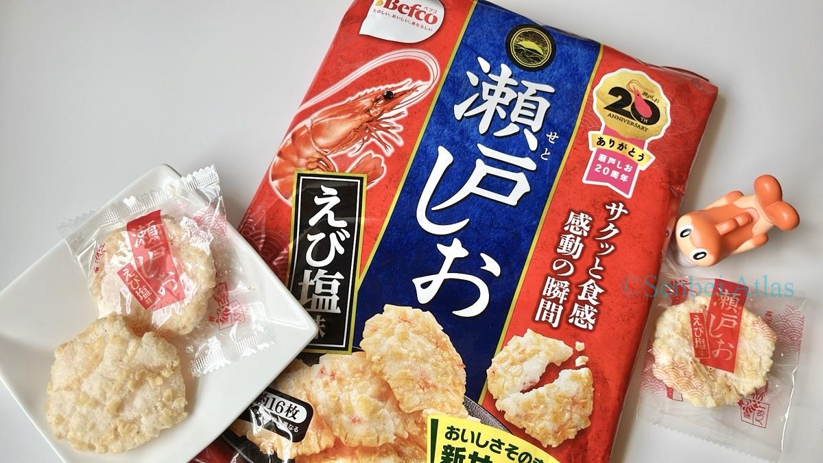 Package and contents of Seto Shio (瀬戸しお) with a Tatsugiri (シャリタツ) figure in the background.