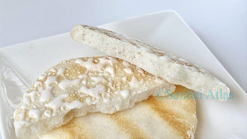 Close-up of a Yuki no Yado (雪の宿) cracker cross-section on a plate.