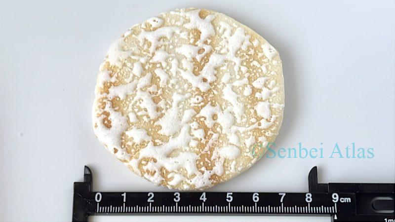 Measuring the size of a Yuki no Yado (雪の宿) cracker with a ruler.