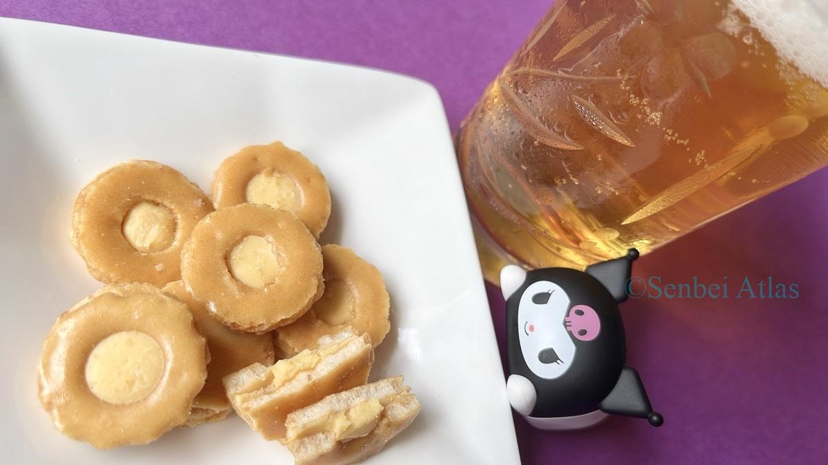 Cheese Okaki (チーズおかき) and a glass of beer with a Kuromi (クロミ) figure