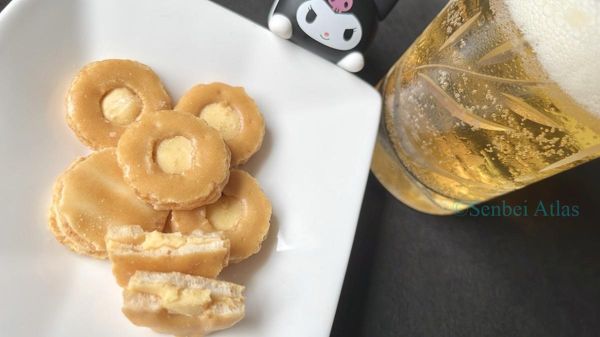 Cheese Okaki (チーズおかき) and a glass of beer with a Kuromi (クロミ) figure