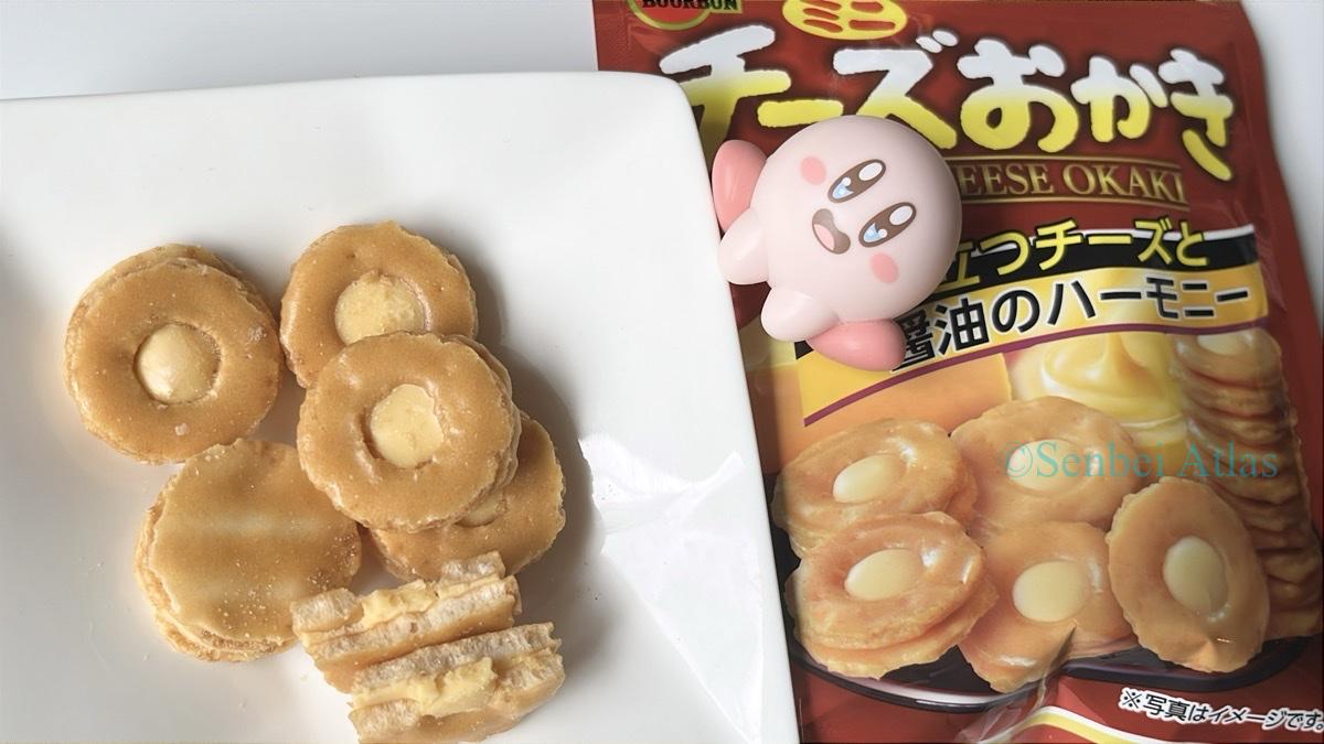 The package of Cheese Okaki (チーズおかき) and the contents, including a cross-section, on a plate with Kirby (カービー)