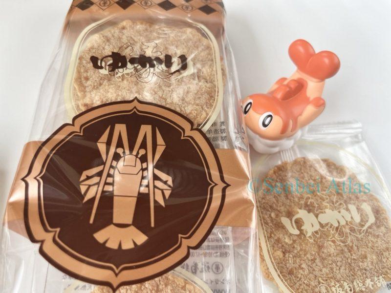 Yukari (ゆかり) package and contents with Tatsugiri (シャリタツ) in the background.