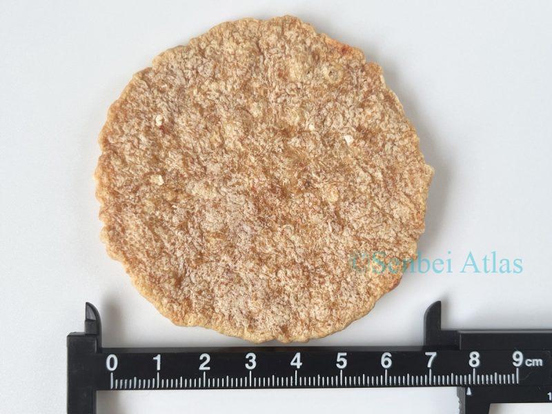 Measuring the size of a Yukari (ゆかり) shrimp cracker with a ruler.